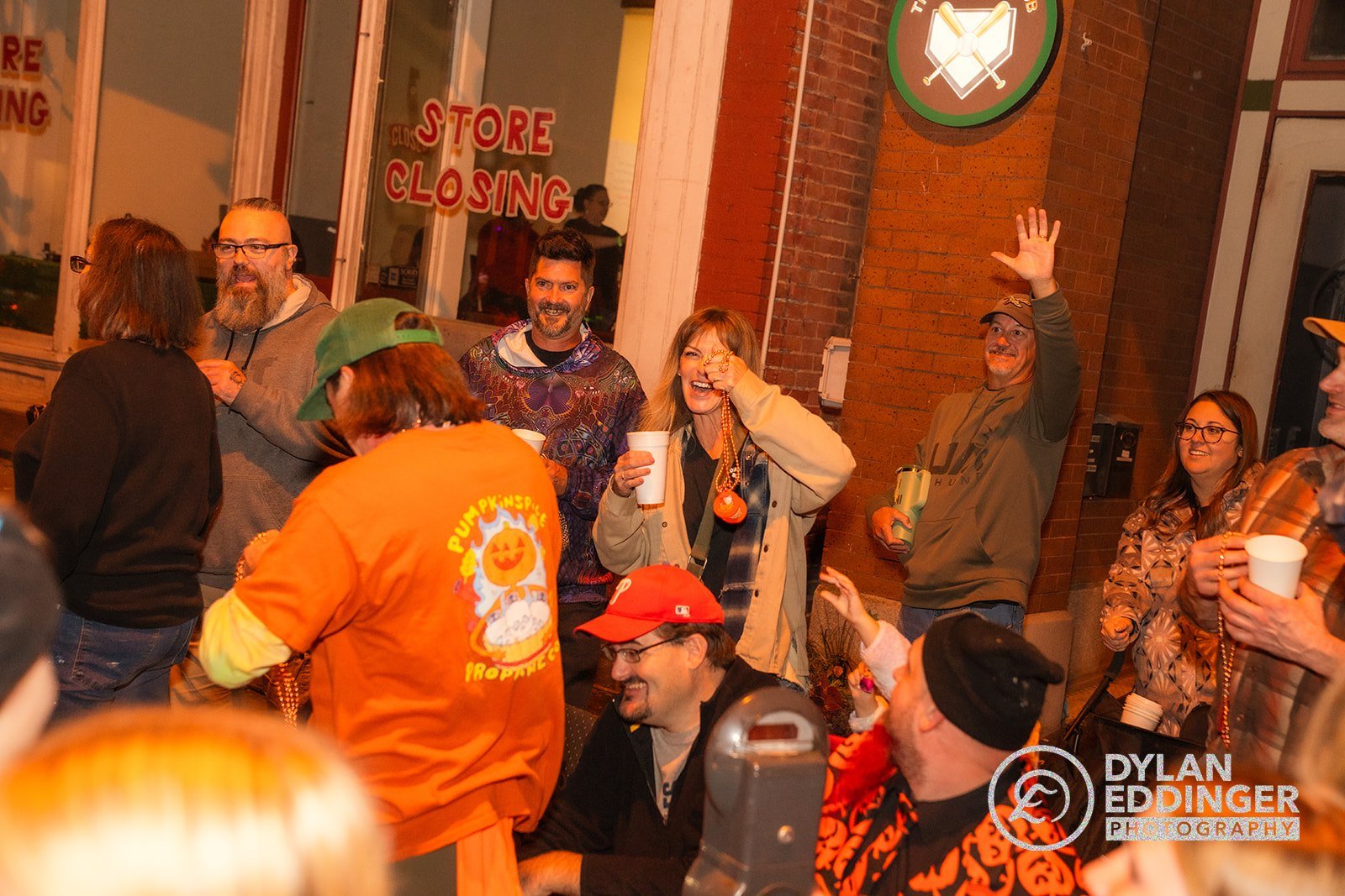 Parade attendees with Pumpkin Spice Propane shirts and beads