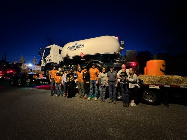 Eddinger Propane parade float with jack-o'-lantern tank and crew